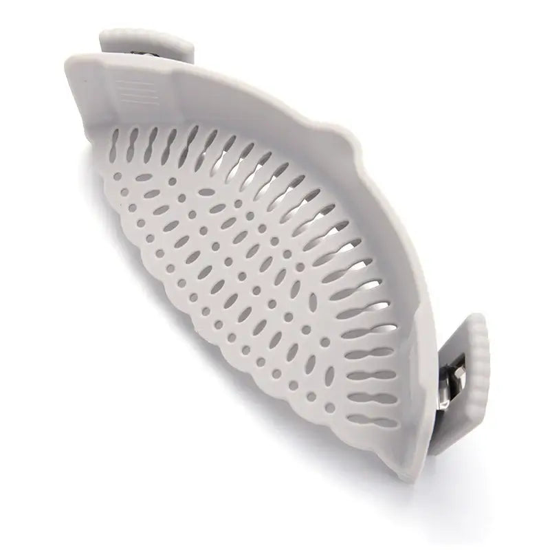 Clip-on silicone strainer with clips for secure fit on pots and bowls, made of BPA-free, food grade material.