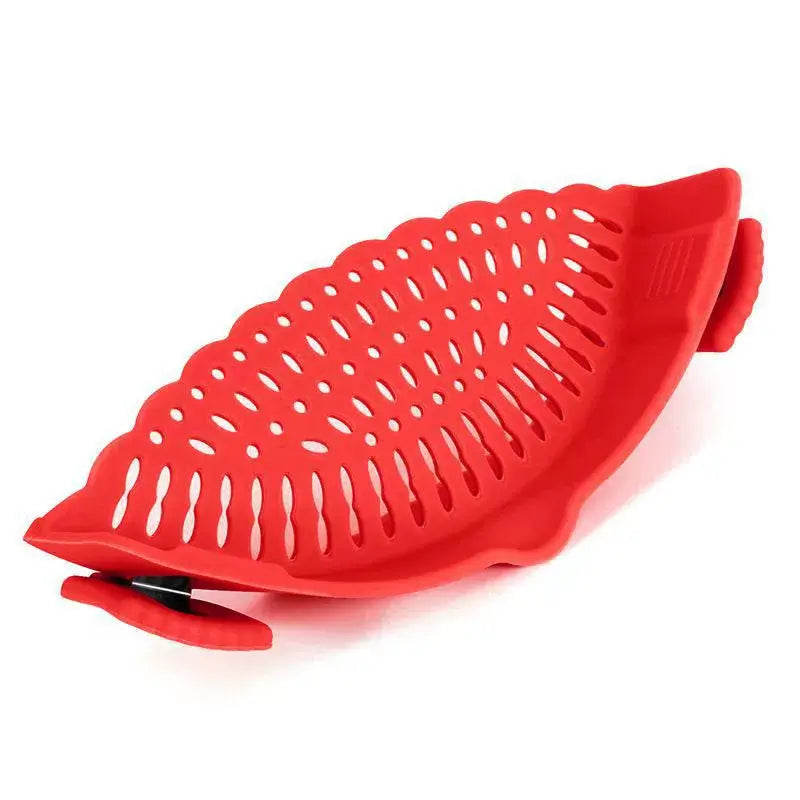 Red clip-on silicone strainer with secure clips, designed for effortless food draining and storage.